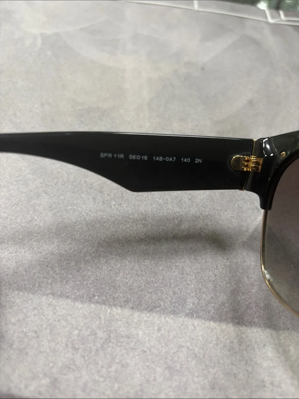 Prada Black Cat-Eye Sunglasses with Gold Trim